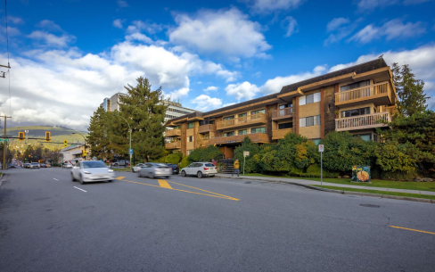 Picture of the building exterior of Harvard Apartments from the North East view from St. Georges Avenue.