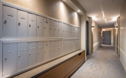 Harvard Apartments tenant mail slots looking into common area hallway